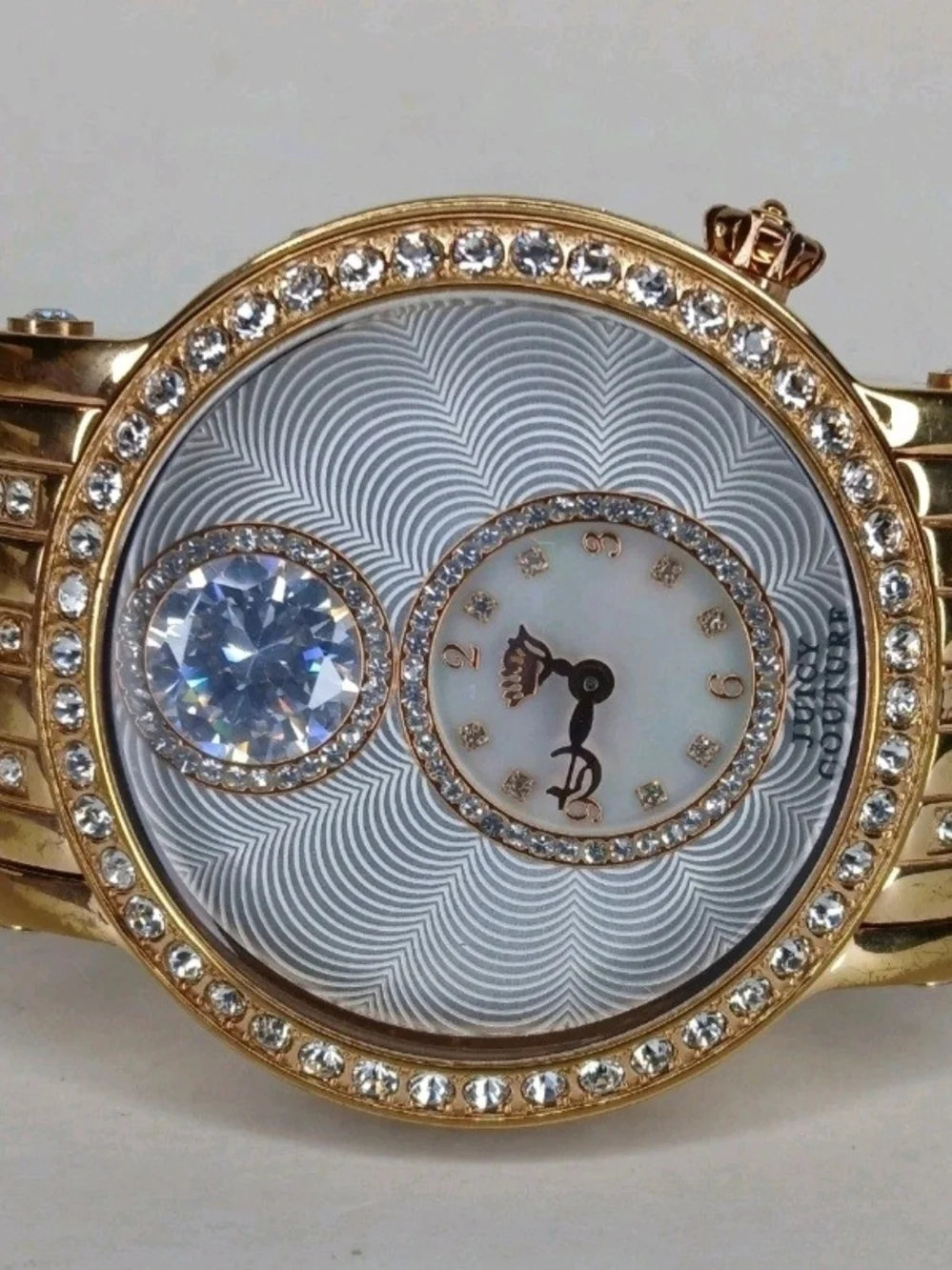 ​Juicy Couture Gold Tone Crystal Bezel Floating Solitaire Watch